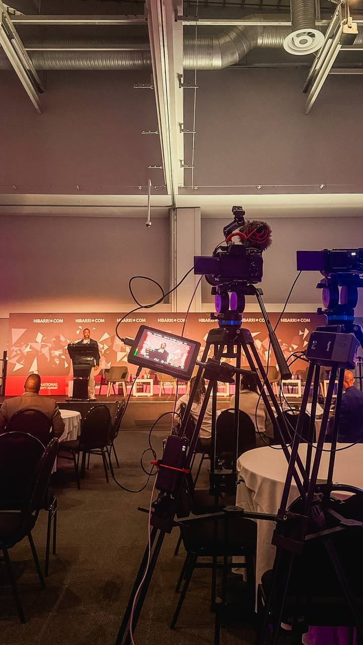 Two locked-off cameras covering a summit stage