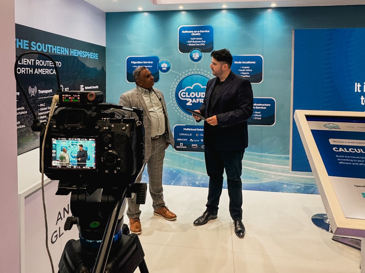Crew filming interviews on the conference floor at AfricaCom